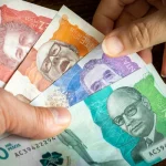 depositphotos_563591932-stock-photo-colombian-money-lots-pesos-banknotes