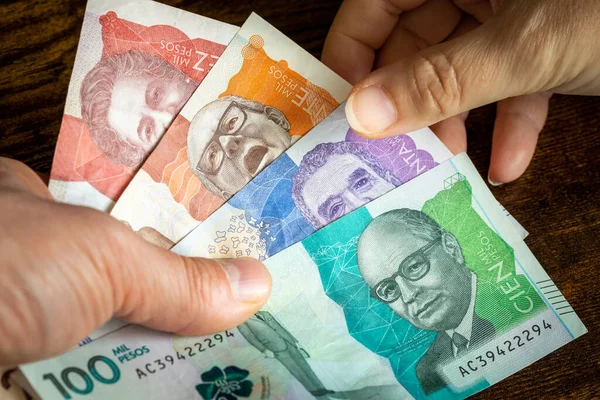 depositphotos_563591932-stock-photo-colombian-money-lots-pesos-banknotes